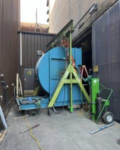A steel gantry rental from LGH Canada lifting a heavy industrial load.