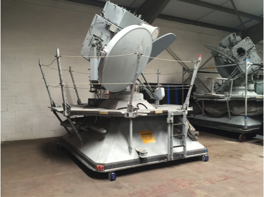 Photo of four compression load cells that were used to lift and weigh a missile tracker. The tracker itself weighed 8,125 lbs, which the load cells calculated correctly.