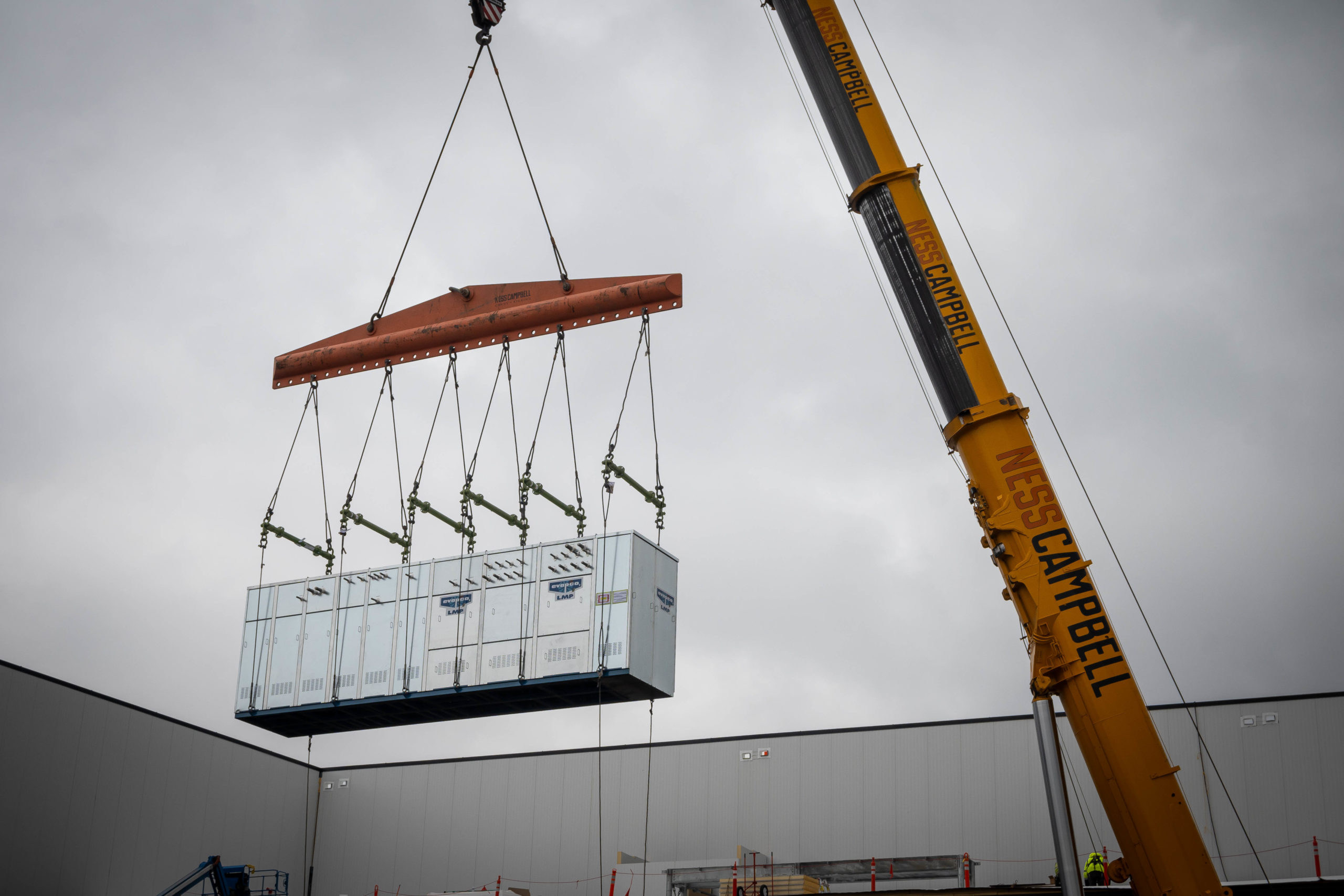 Jobsite picture from LGH and Ness Campbell case study, working on a chiller rack installation in Milwaukie, Oregon.