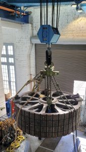 hydroelectric turbine generator rotor fully erected into a vertical position