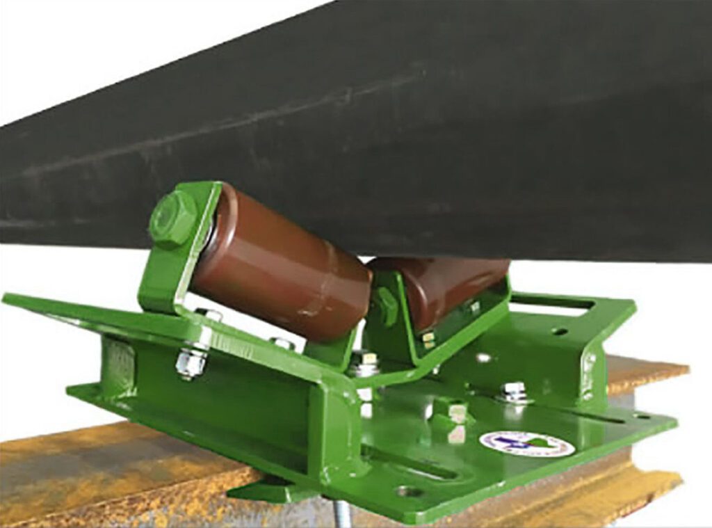 A green LGH pipe rack roller, rolling a pipe across it.