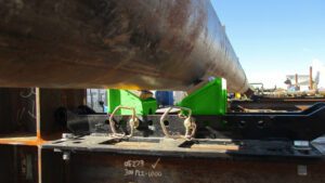 2 ton beam clamp pipe rollers from LGH being used on a jobsite.