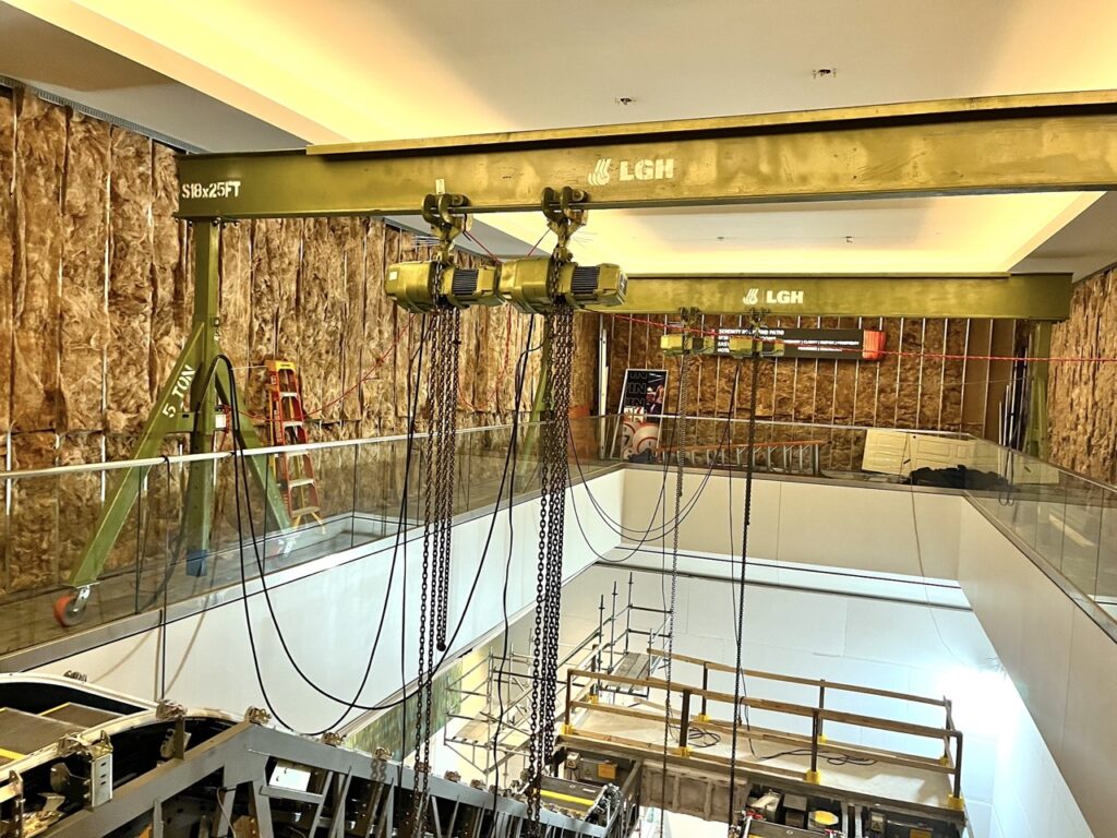 LGH gantry cranes and hoists lifting an escalator