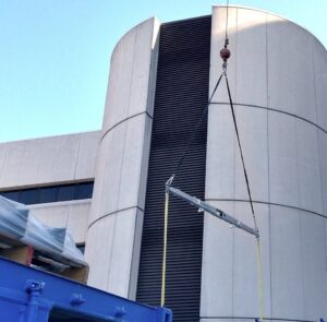 The STR9+ telescopic spreader beam lifting a load at Froedtert Hospital in Milwaukee, WI.