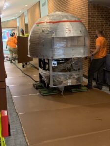 Air skates were used to transport a pizza oven into a retirement community