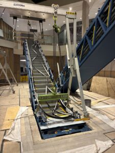 Escalator installation with aluminum gantry cranes and lifting beam