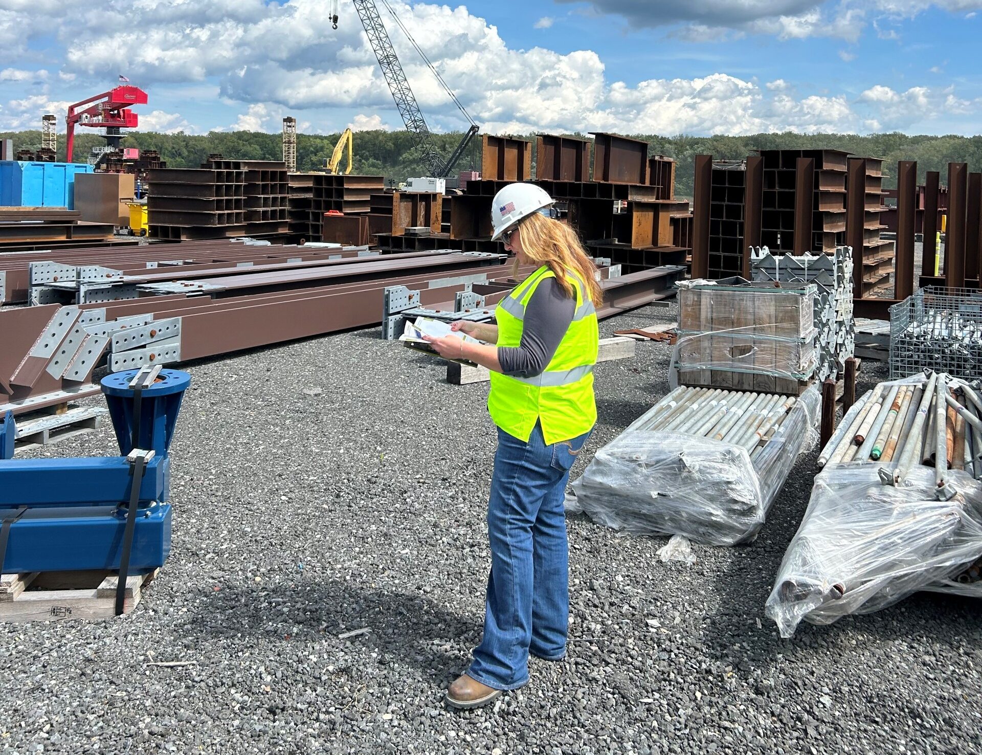 LGH Rental Representative on jobsite with equipment renal catalog