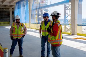 LGH rental rep discusses project needs with customers on jobsite in Dallas