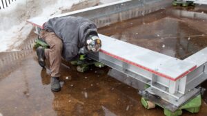 crew positions a load rotating machine skates on jobsite